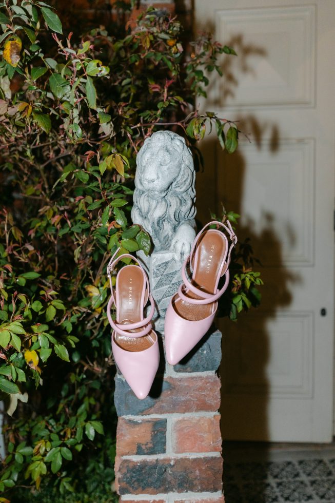 Heels on a Garden Statue for a flash image at Kingsdown Manor Wedding
