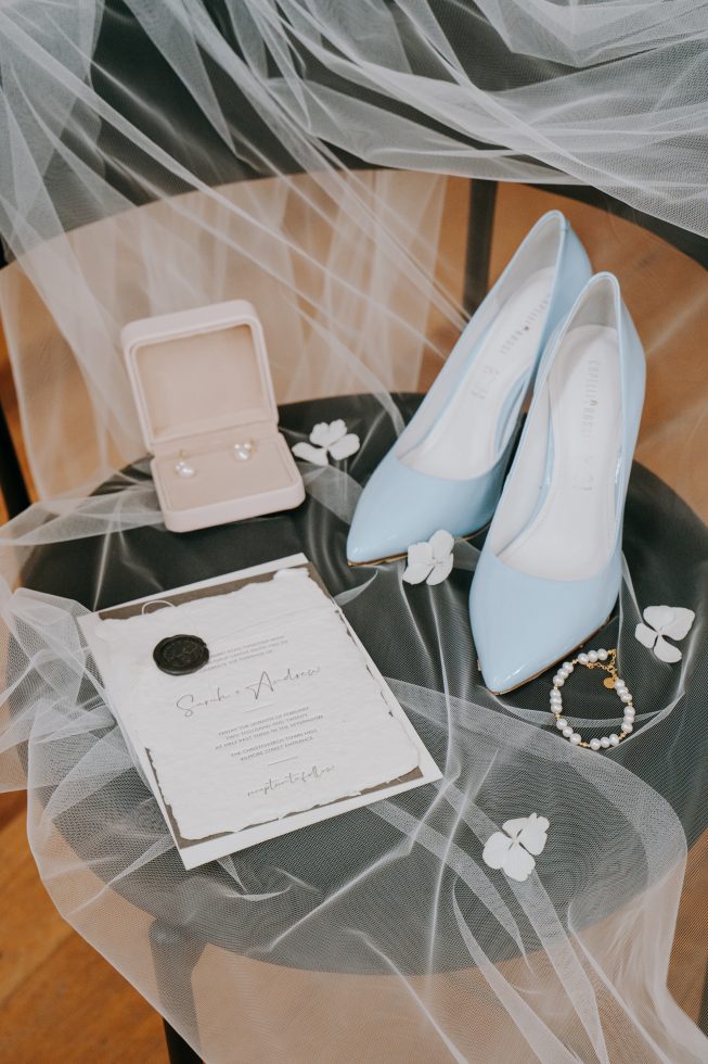 Christchurch inner city wedding details: Light blue bridal heels and a square velvet ring box styled at The Welder venue.