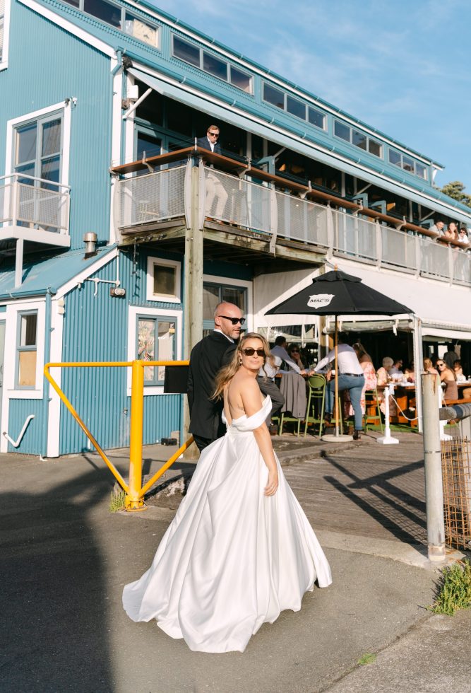 Fine art bridal portrait outside a coastal reception venue at twilight