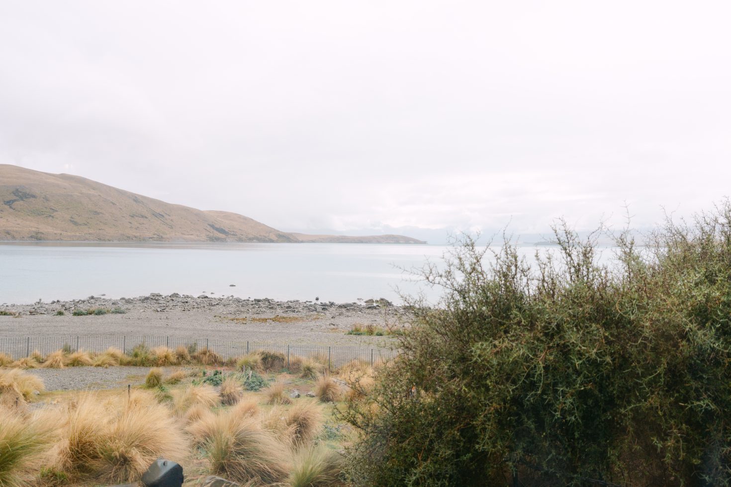 Wide mountain landscape look captured by a Lake Tekapo photographer at a Church of the Good Shepherd wedding.