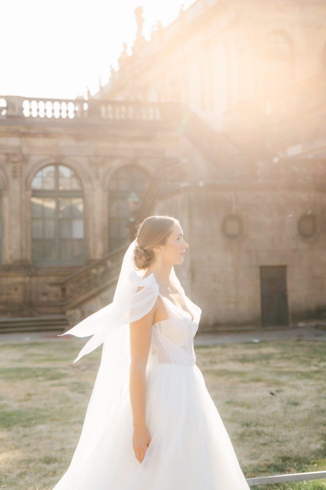 Fine art bridal portrait: Bride Emi captured in warm, backlit golden hour light by Agnes Grace Photo & Film.