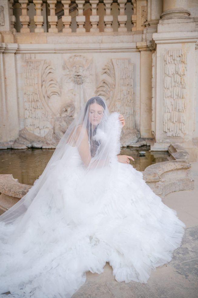 Editoral destination wedding photography: Photo of a bride with a long tulle veil in Dresden by Agnes Grace Photo & Film.