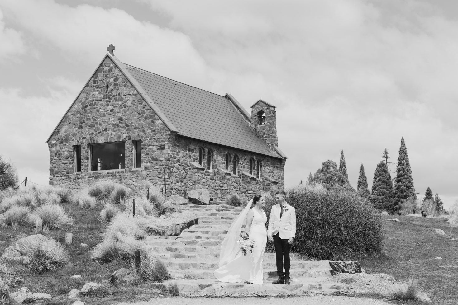 A classic black and white architectural portrait of the heritage venue for a Tekapo Church of the Good Shepherd wedding guide.