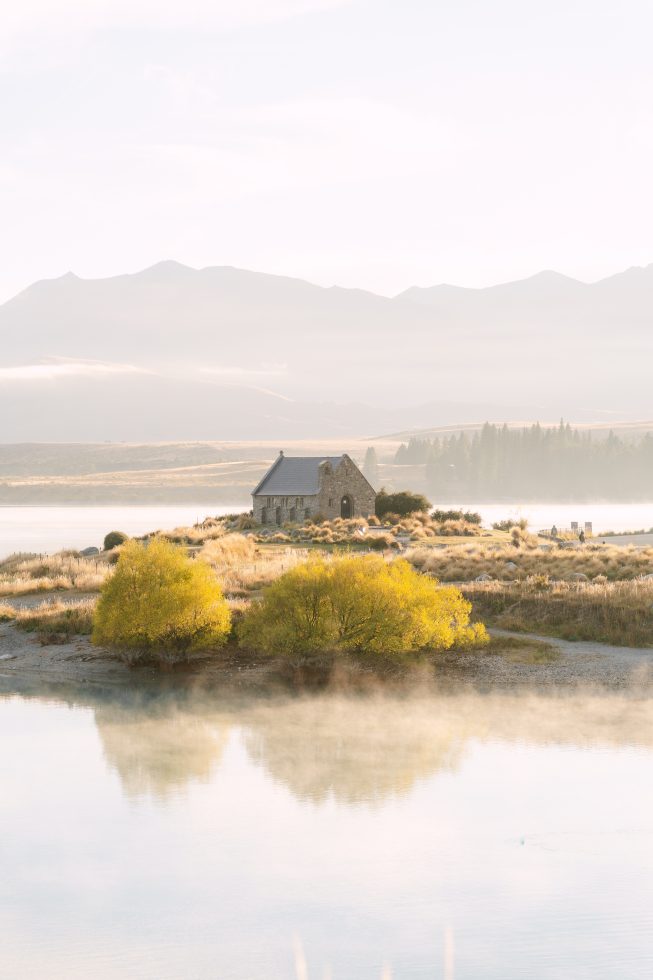 The stone church nestled in the Tekapo tussock hills for a classic Church of the Good Shepherd wedding.