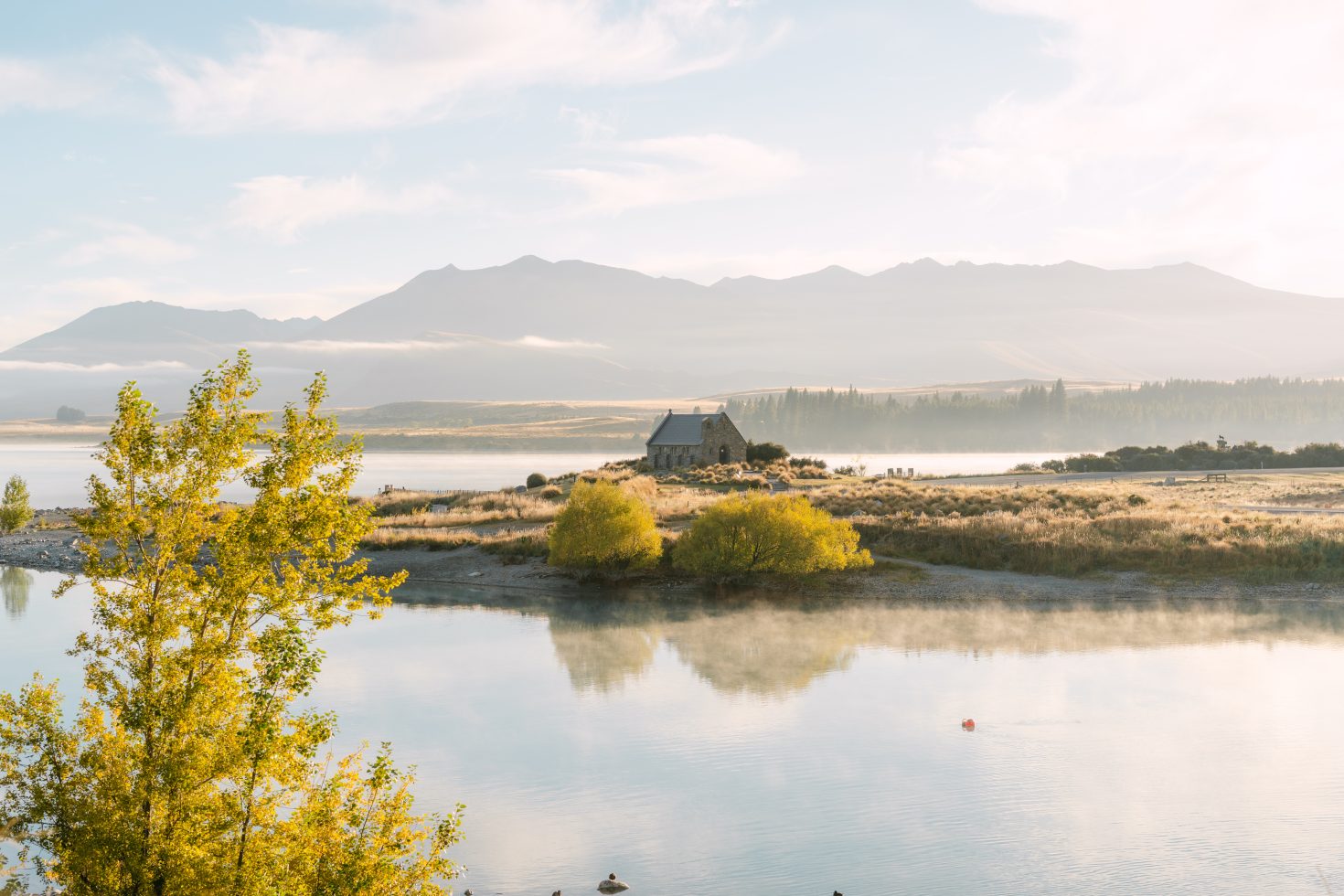 Scenic panoramic view of the mountain landscape framing a beautiful Church of the Good Shepherd wedding elopement.