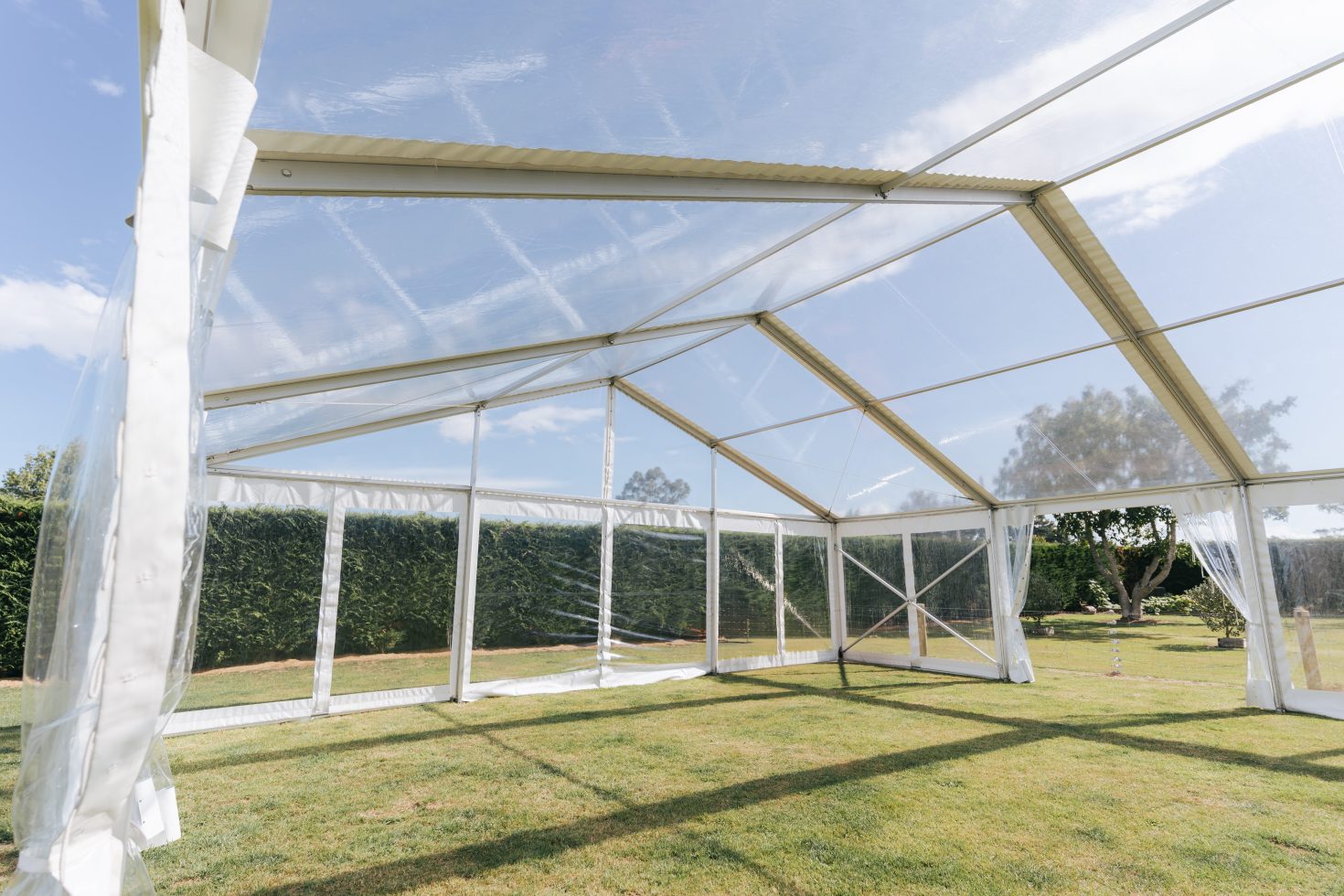 Interior view of an empty clear span wedding marquee layout in Canterbury